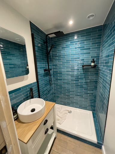 Contemporary shower room renovation in Poole featuring small format wall tiles