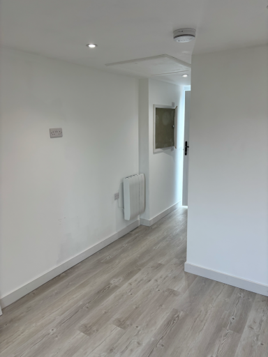 Converted garage in Poole finished as a bright bedroom with en-suite