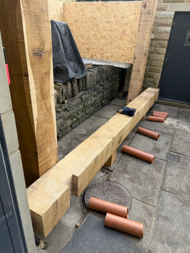 Crafted oak outdoor kitchen shelter enhancing a pizza oven area
