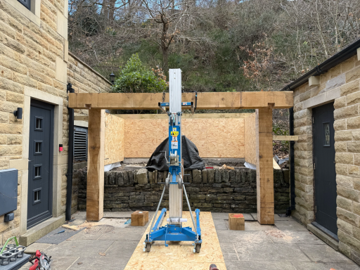 Oak pizza oven shelter providing weather protection