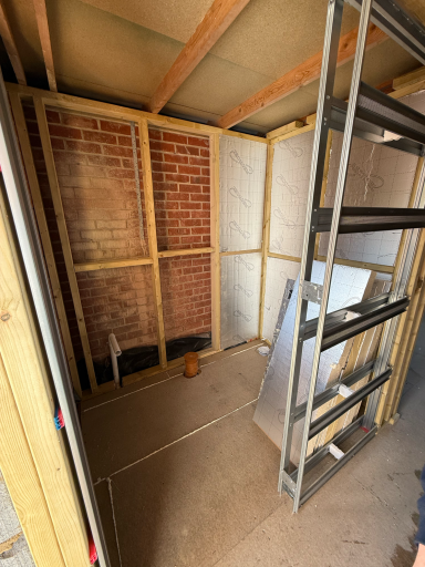 Modern bedroom with en-suite formed from a garage conversion in Poole