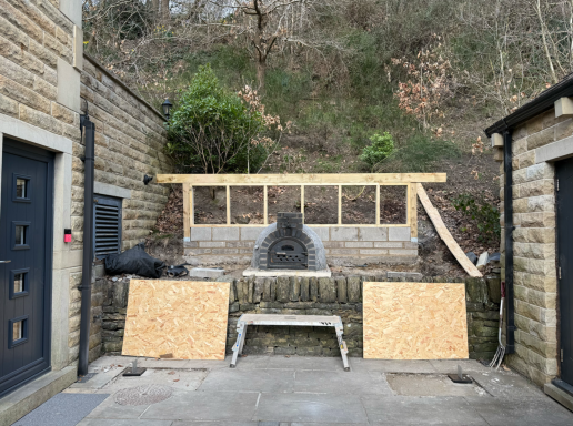 Oak outdoor shelter structure designed for pizza oven use